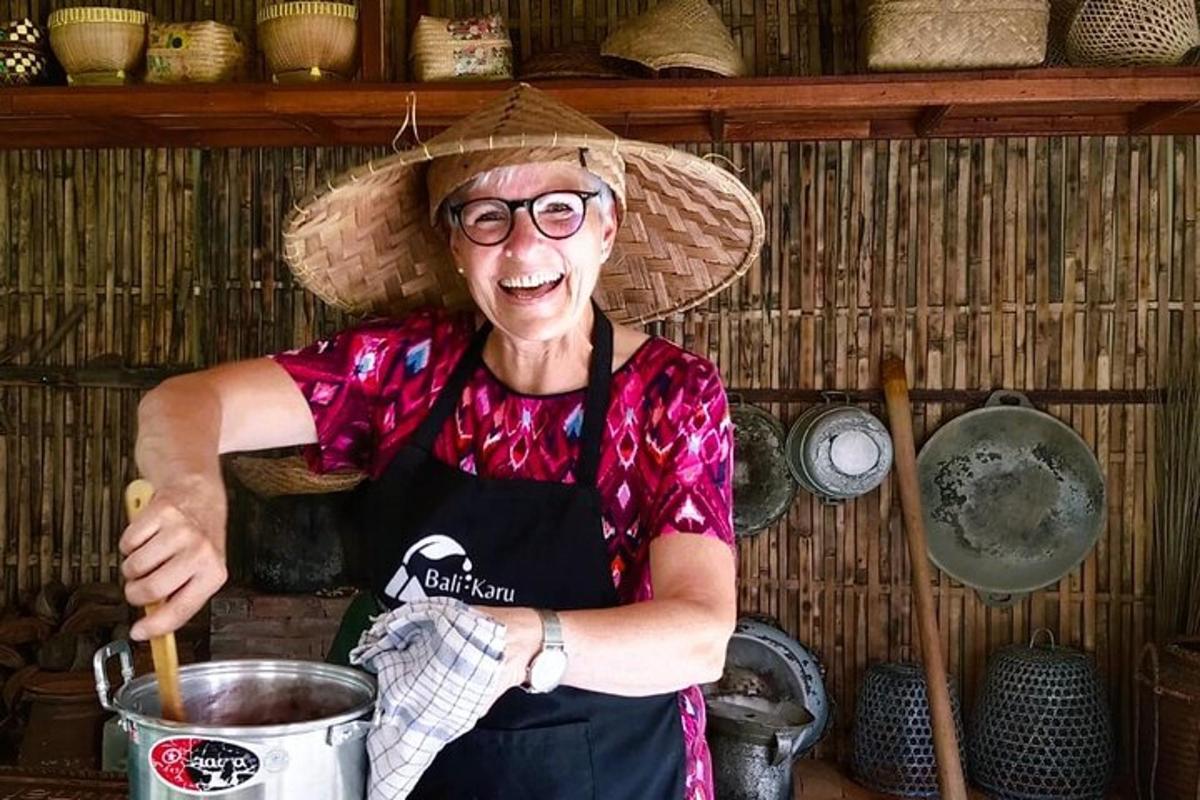an older woman wearing a hat stirring a pot
