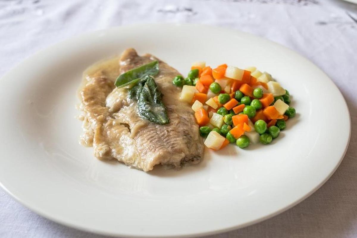a plate of food with meat and vegetables on it