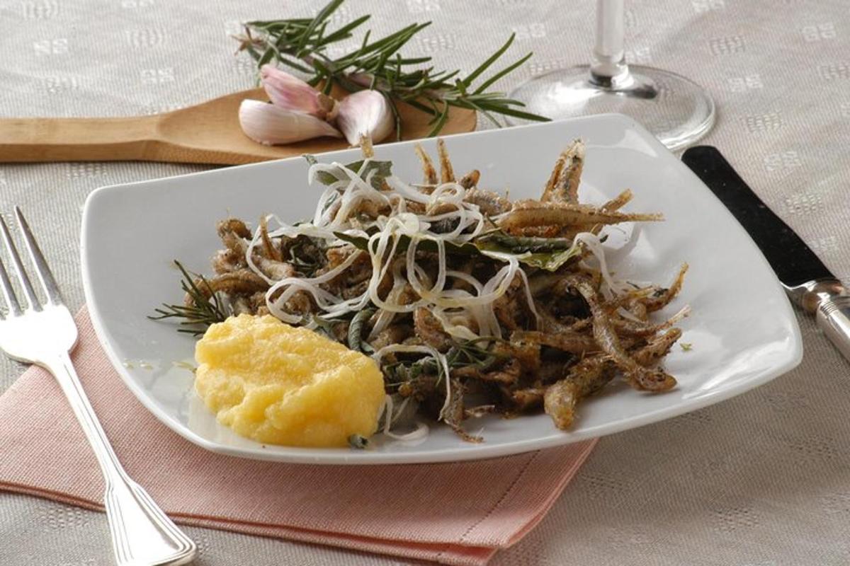 a plate of food on a table with a plate of pasta
