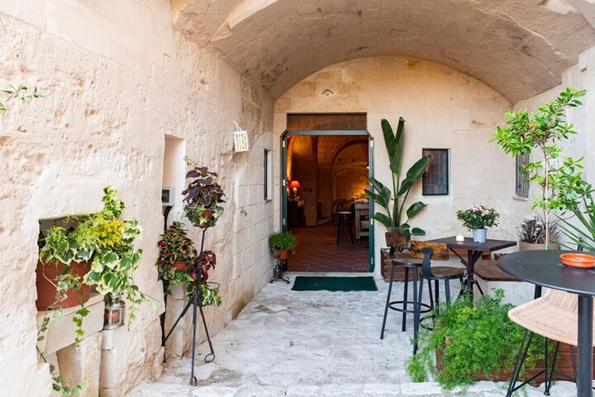an entrance to a building with tables and plants