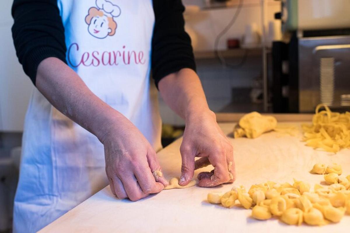 a person in a kitchen preparing food on a cutting board