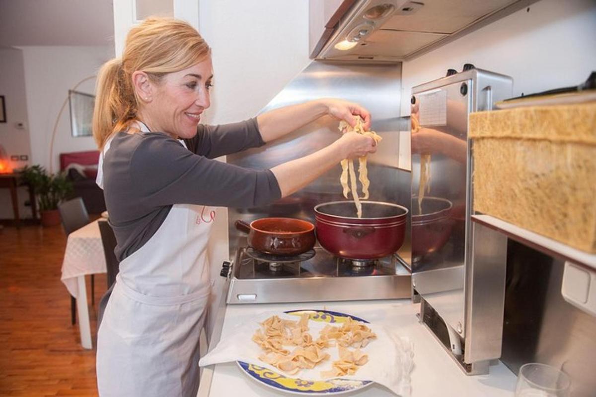 a woman is preparing food in a kitchen