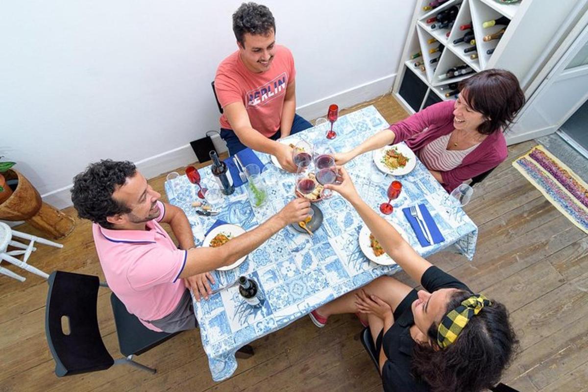 a group of people sitting around a table eating food
