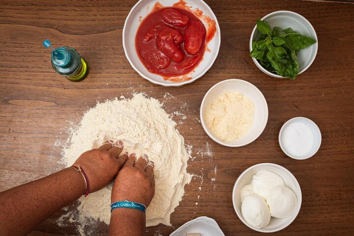 osoba stojící na stole s moukou a dalšími ingrediencemi