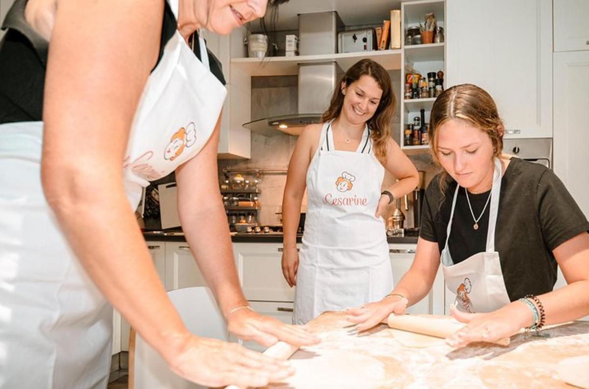 a group of women in a kitchen preparing food