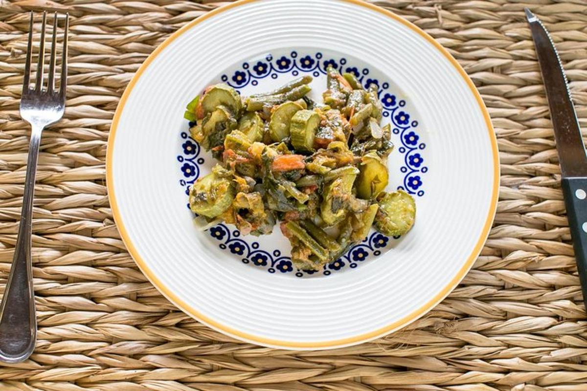 a plate of food with vegetables on a table