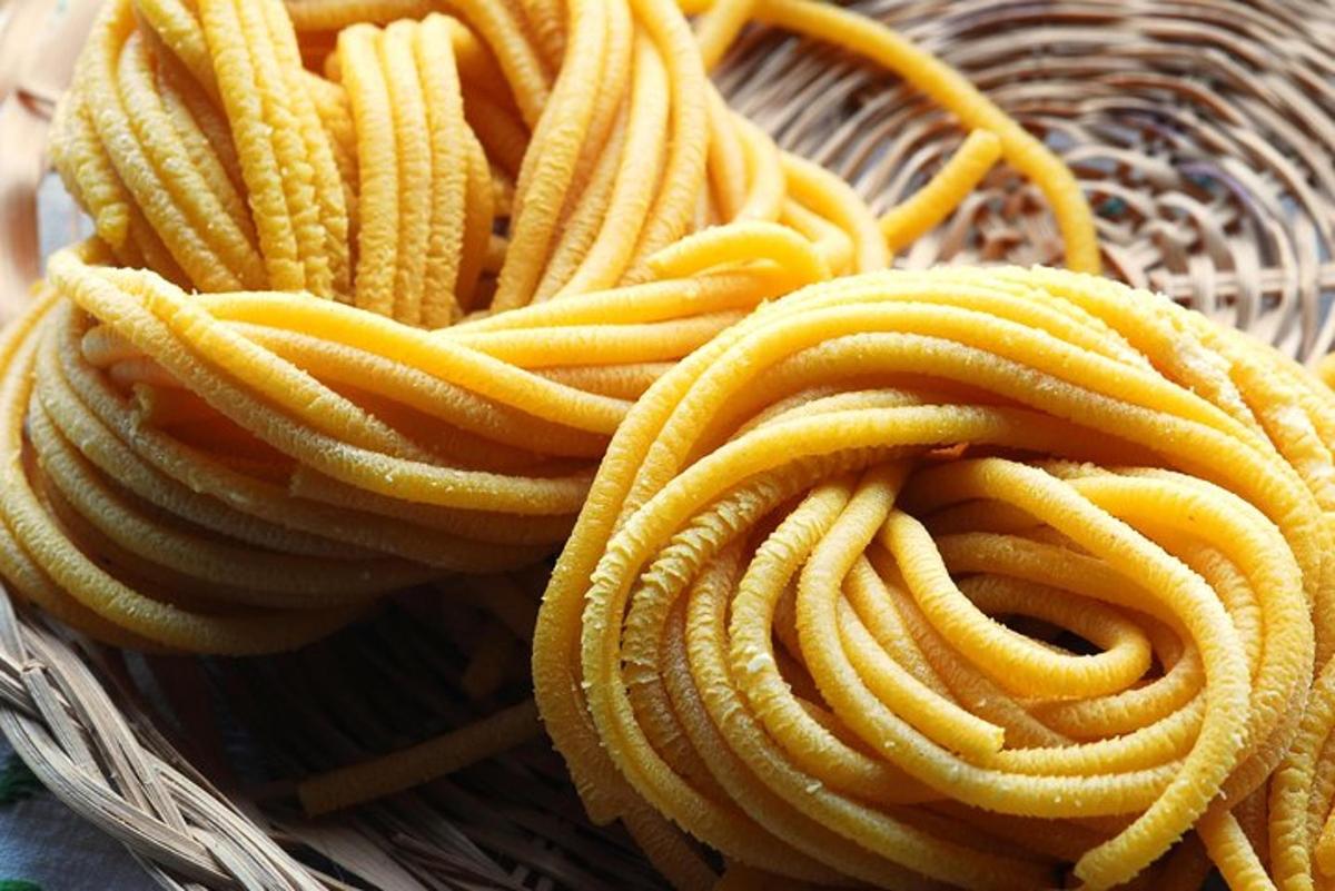 a wicker basket filled with yellow pasta noodles