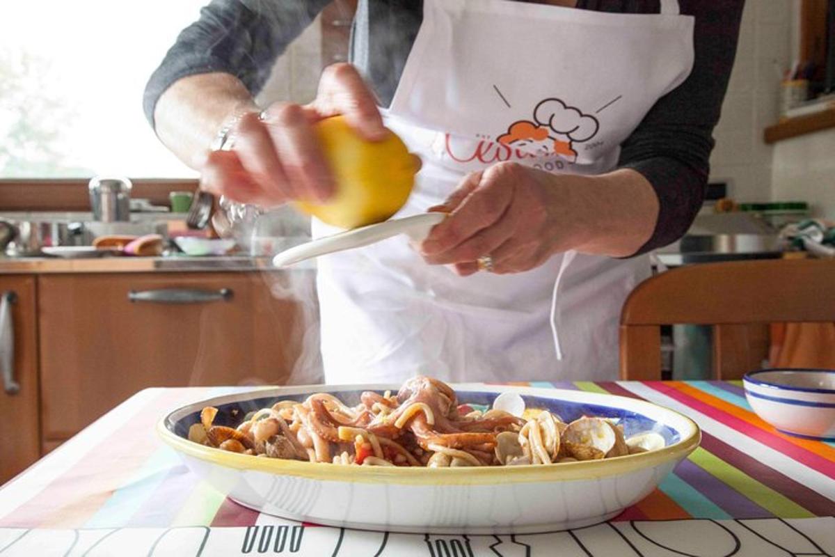 a person in a kitchen preparing a dish of food