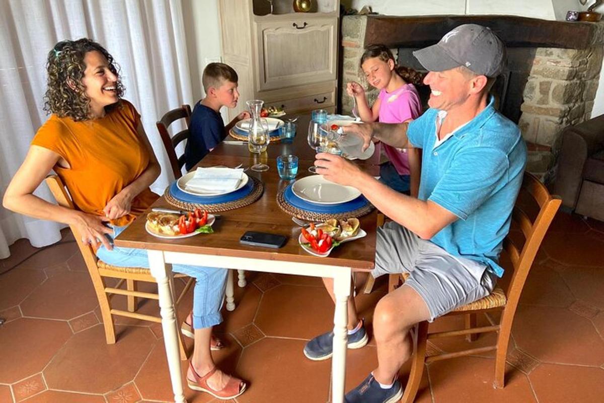 a group of people sitting around a wooden table