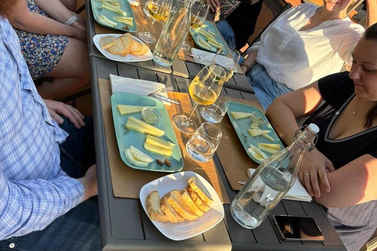 a group of people sitting around a table with food