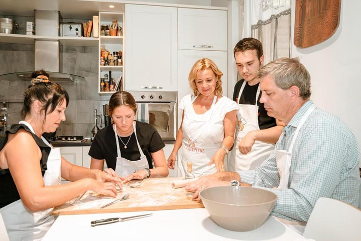 a group of people in a kitchen preparing food