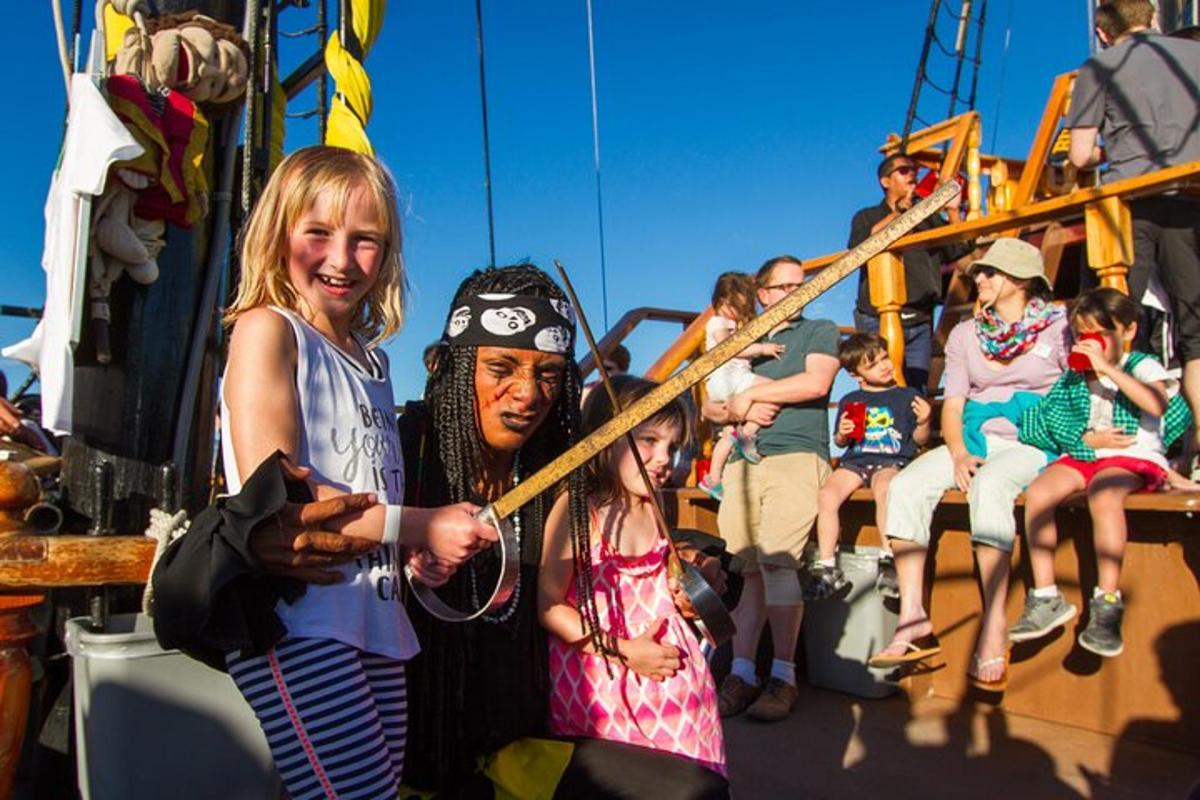 a group of people riding on a pirate ship