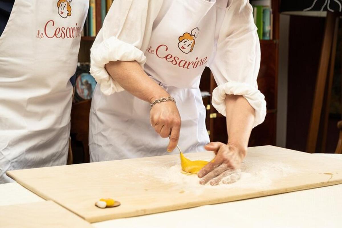 a person in a kitchen preparing food on a cutting board