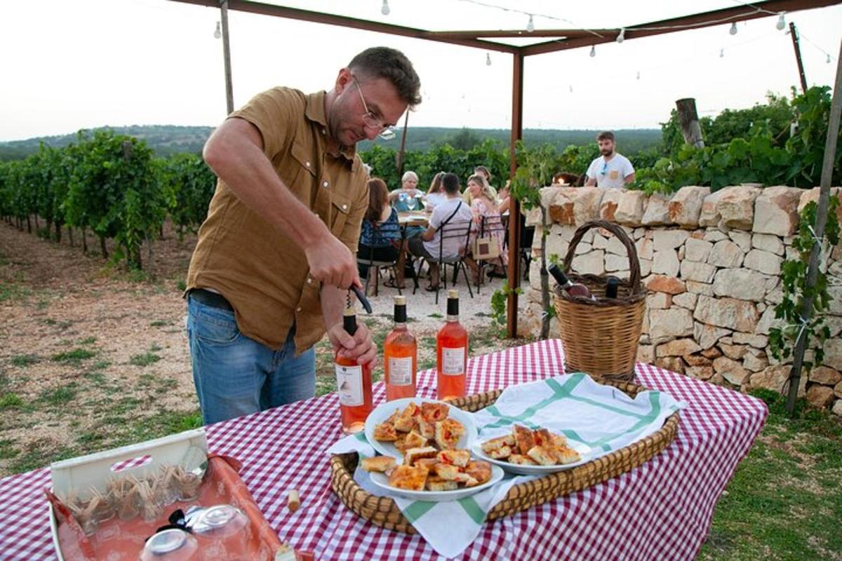 a man standing at a table with a plate of food