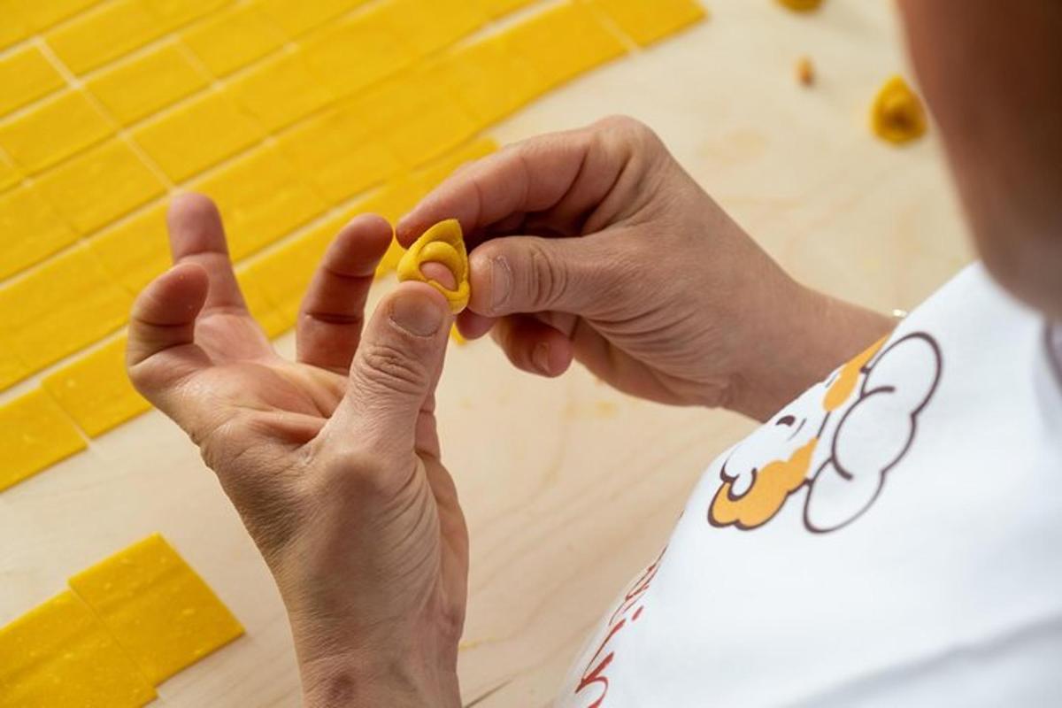 a person holding a piece of food in their hands