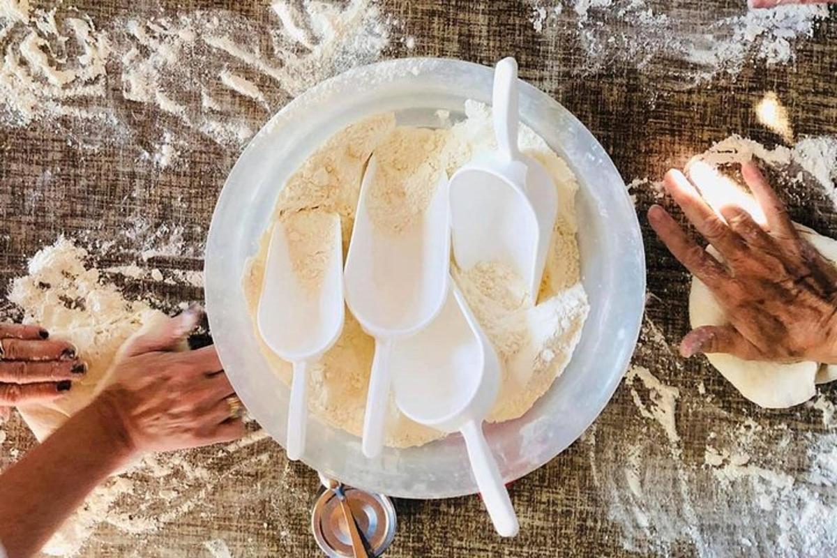 a table with a plate of food with white spoons