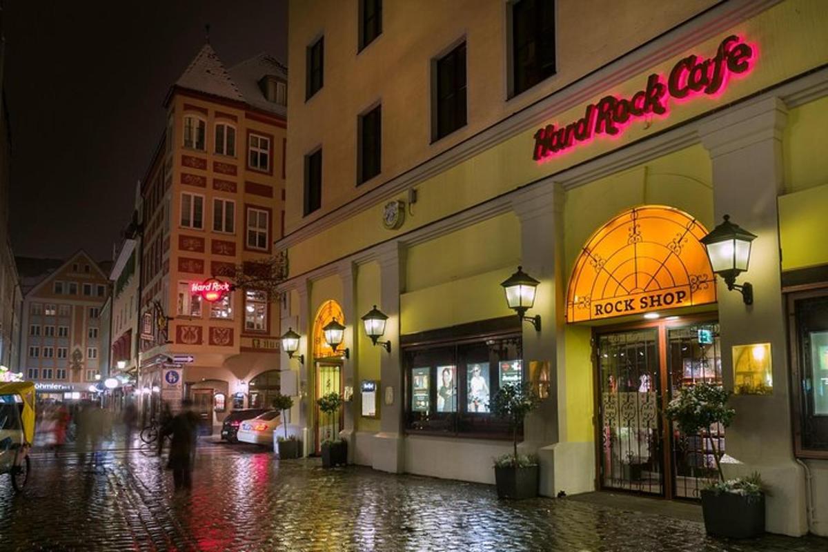 a wet city street at night with a store