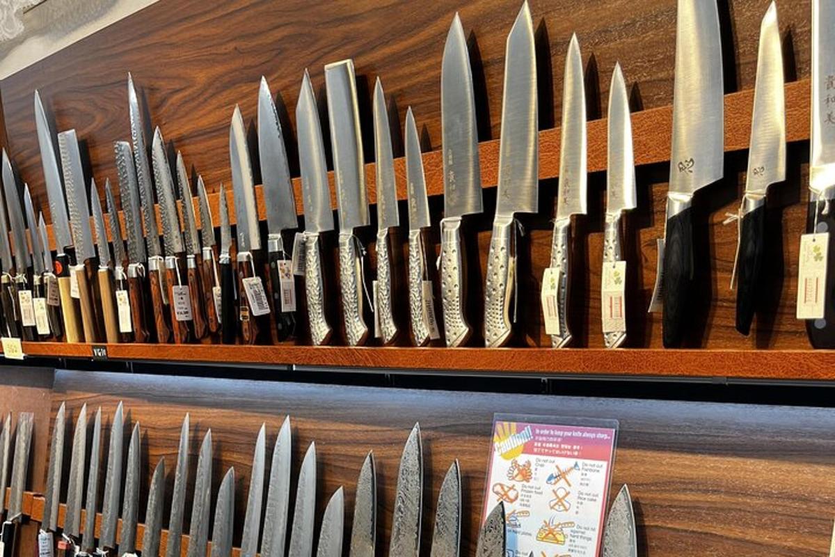a bunch of knives lined up on a shelf