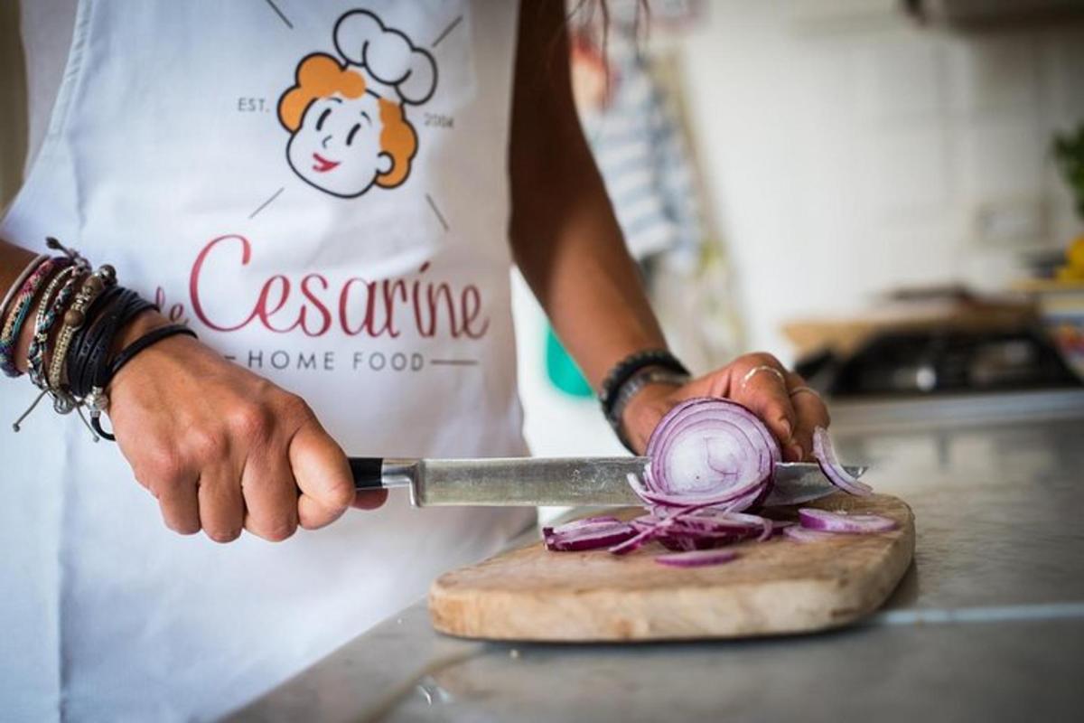 a person is cutting up onions with a knife
