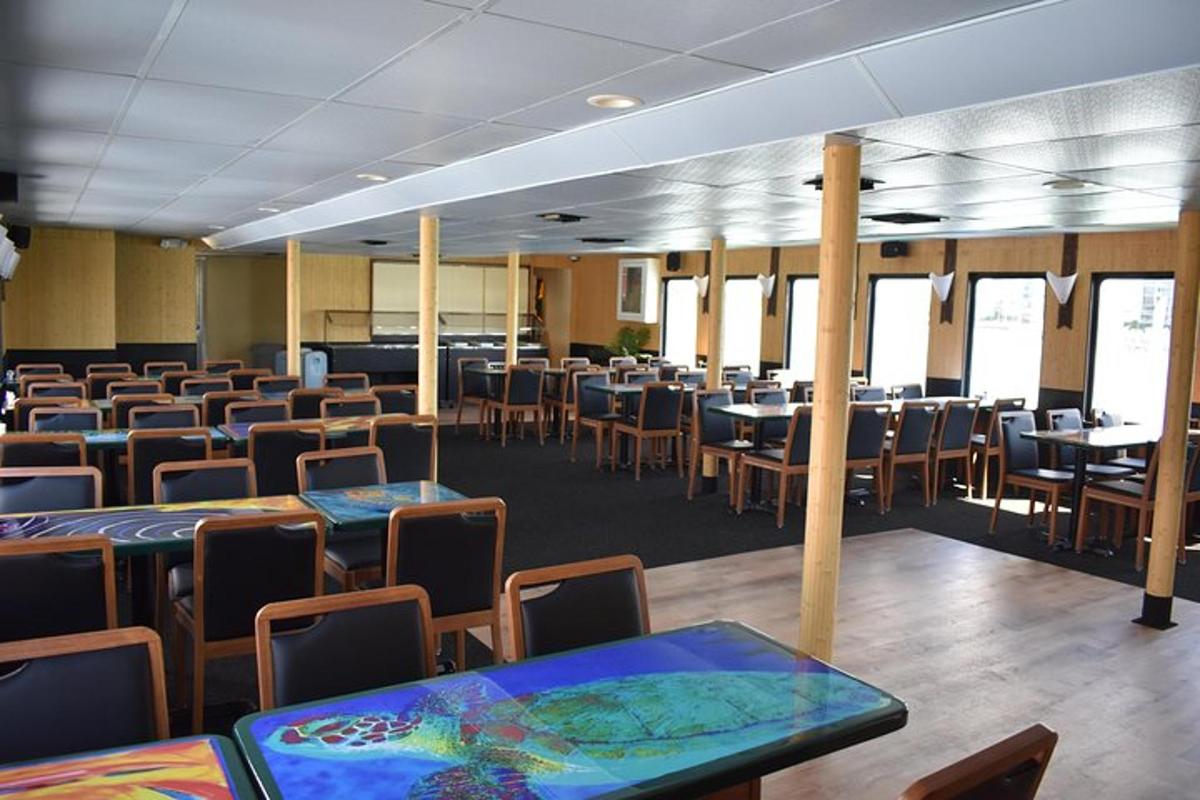 an empty classroom with tables and chairs in a room