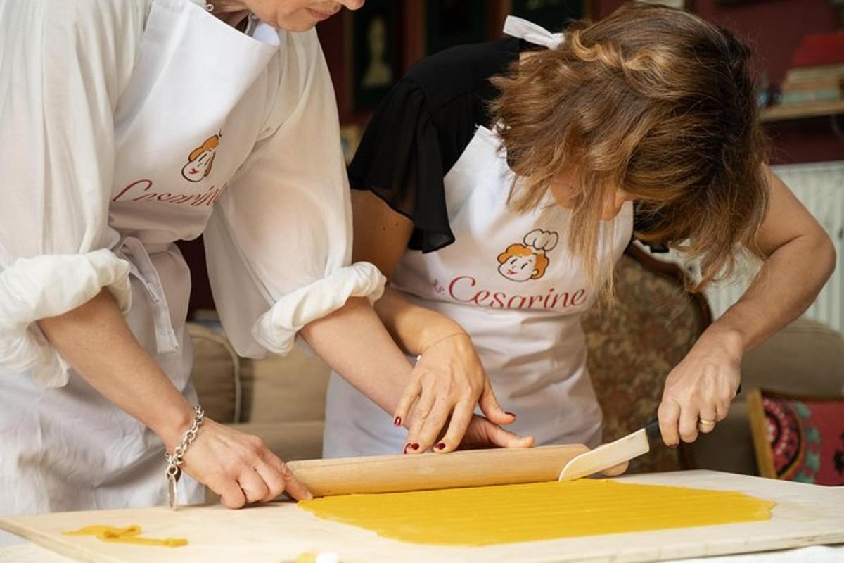 a group of people working on a piece of wood