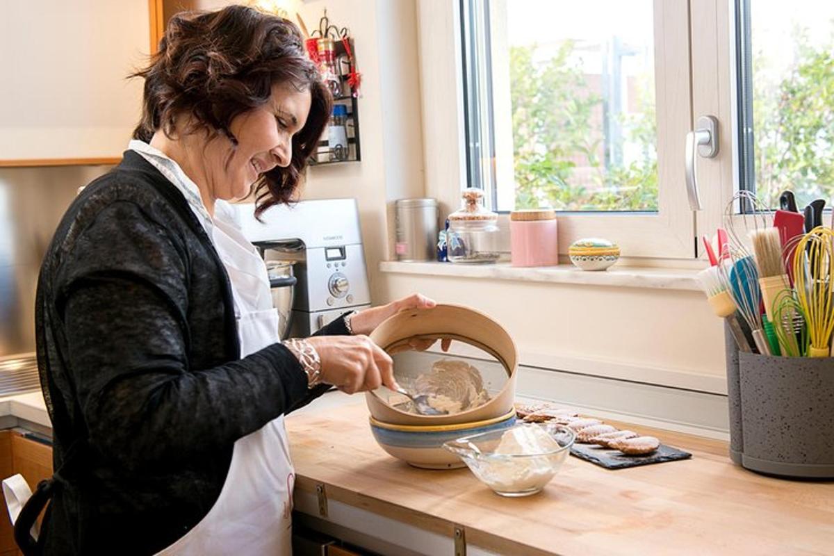 a woman in a kitchen mixing ingredients in a bowl