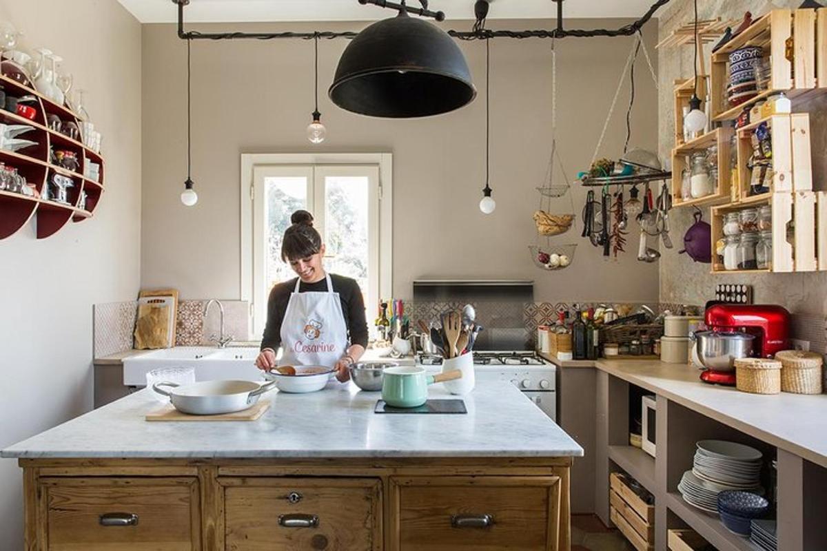 a woman in a kitchen preparing food on a counter