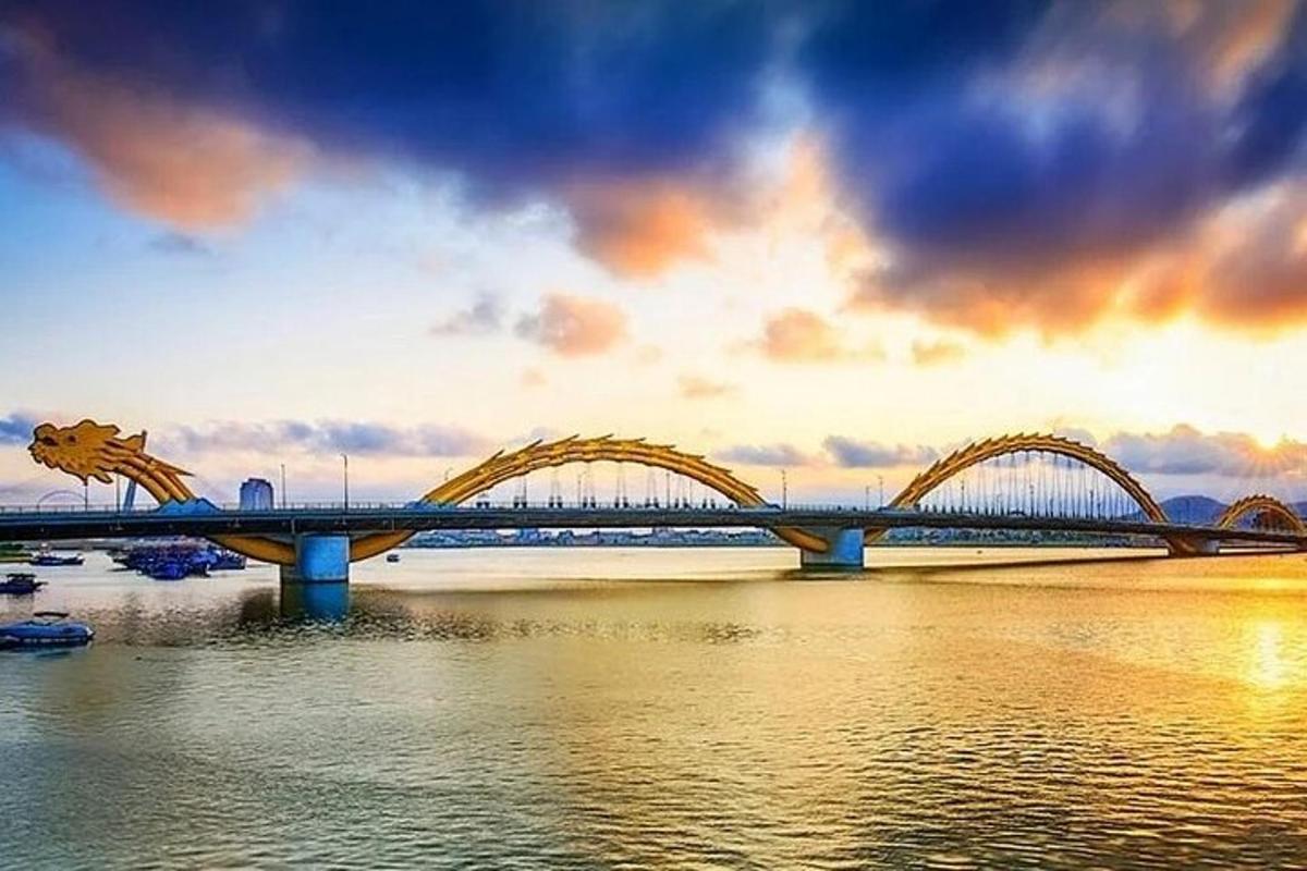 a bridge over a river with a cloudy sky
