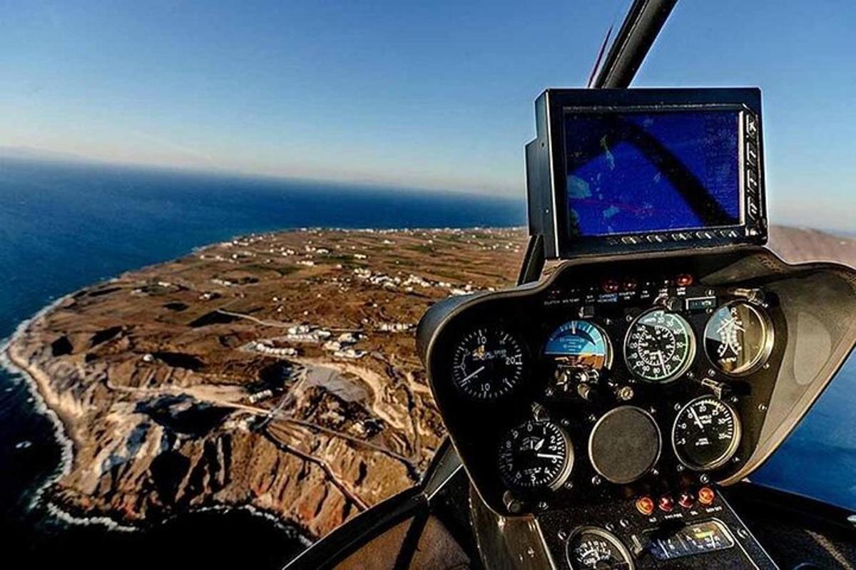 a cockpit of a helicopter flying over a island