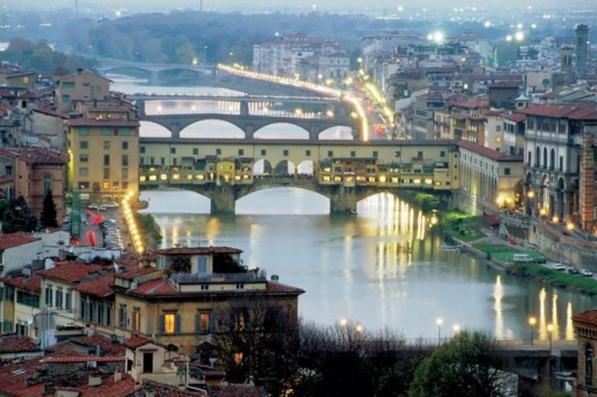 a bridge over a river in a city at night