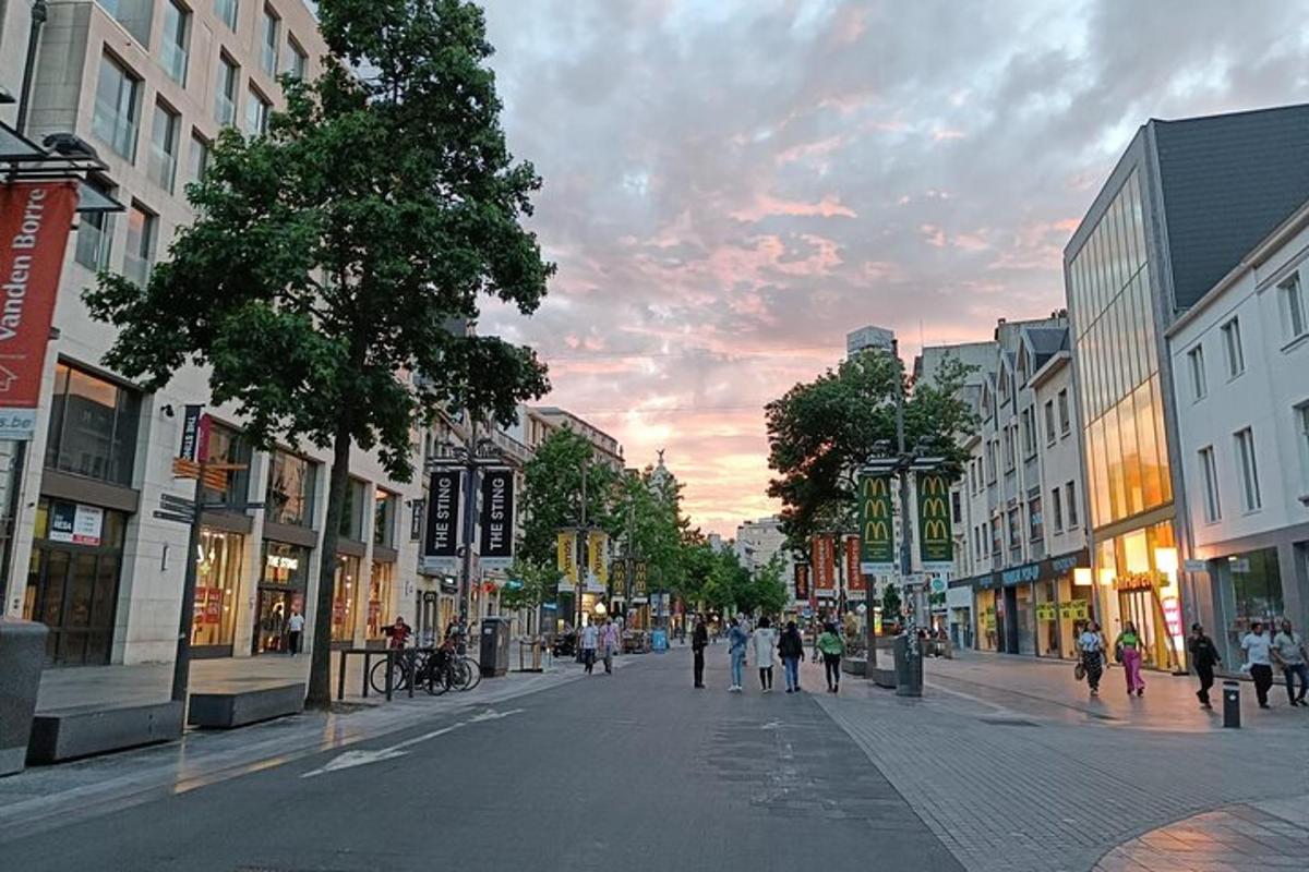 a city street with people walking down the street