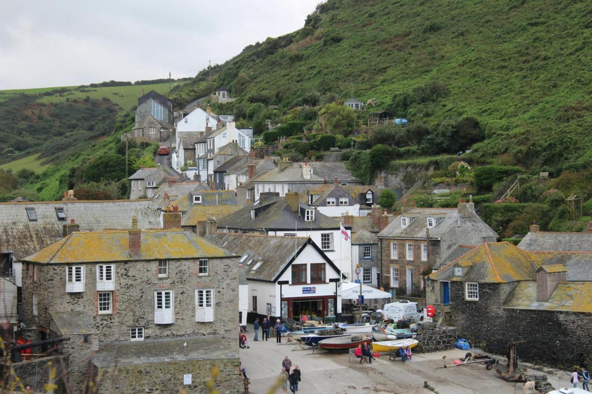 a small town with a bunch of houses on a hill