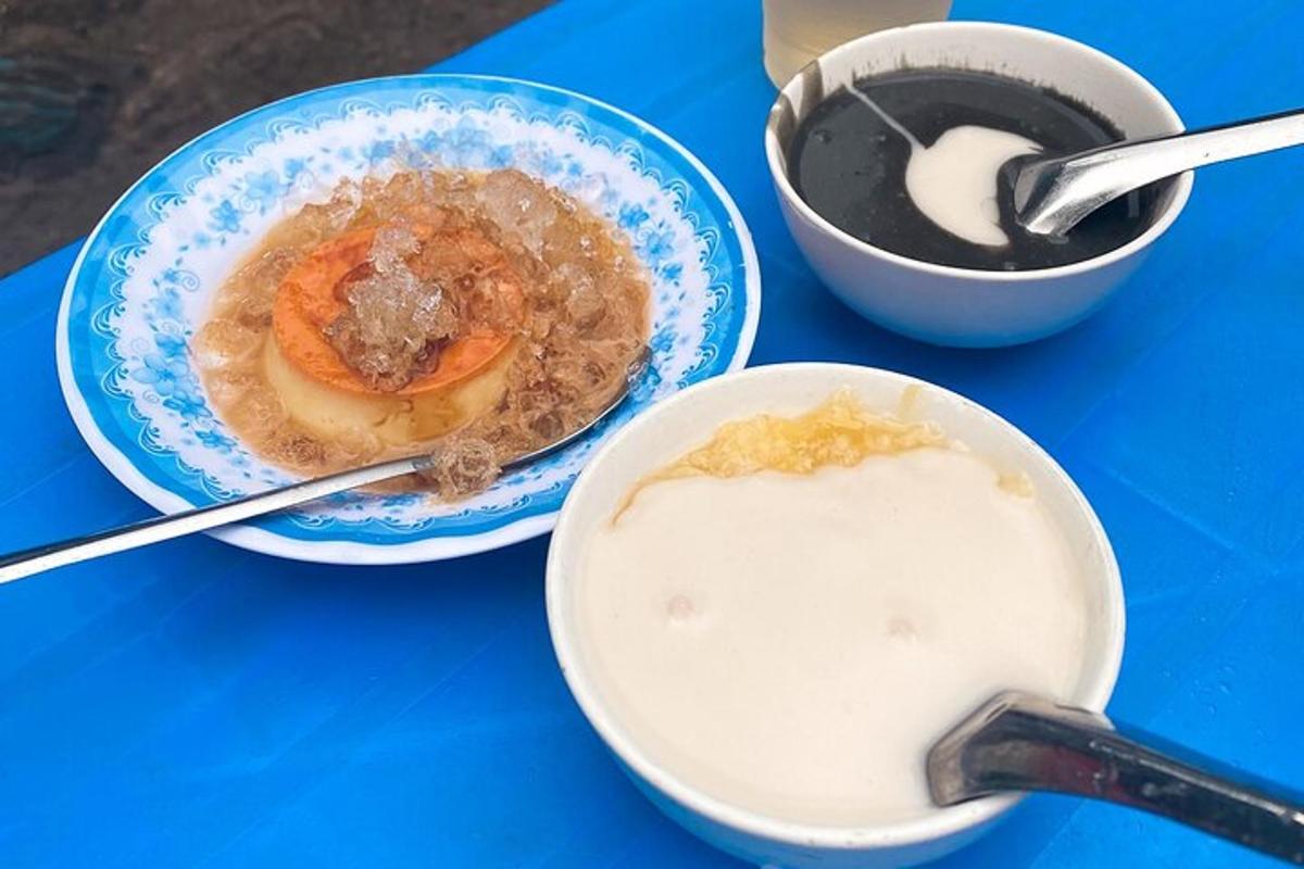 a table with two bowls of food and a bowl of milk