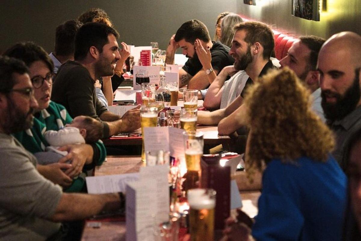 a group of people sitting around a long table