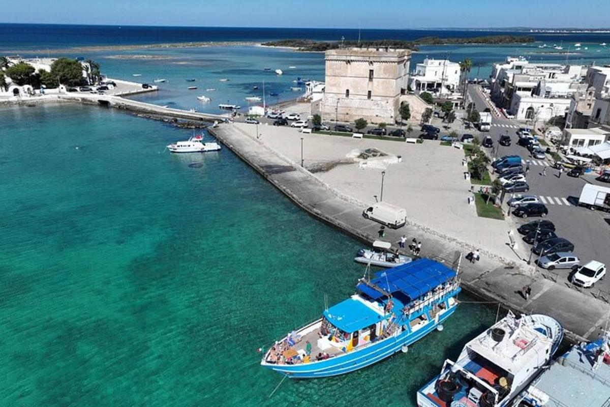a boat in the water next to a pier