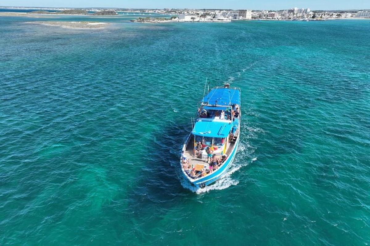 a blue boat in the middle of the water
