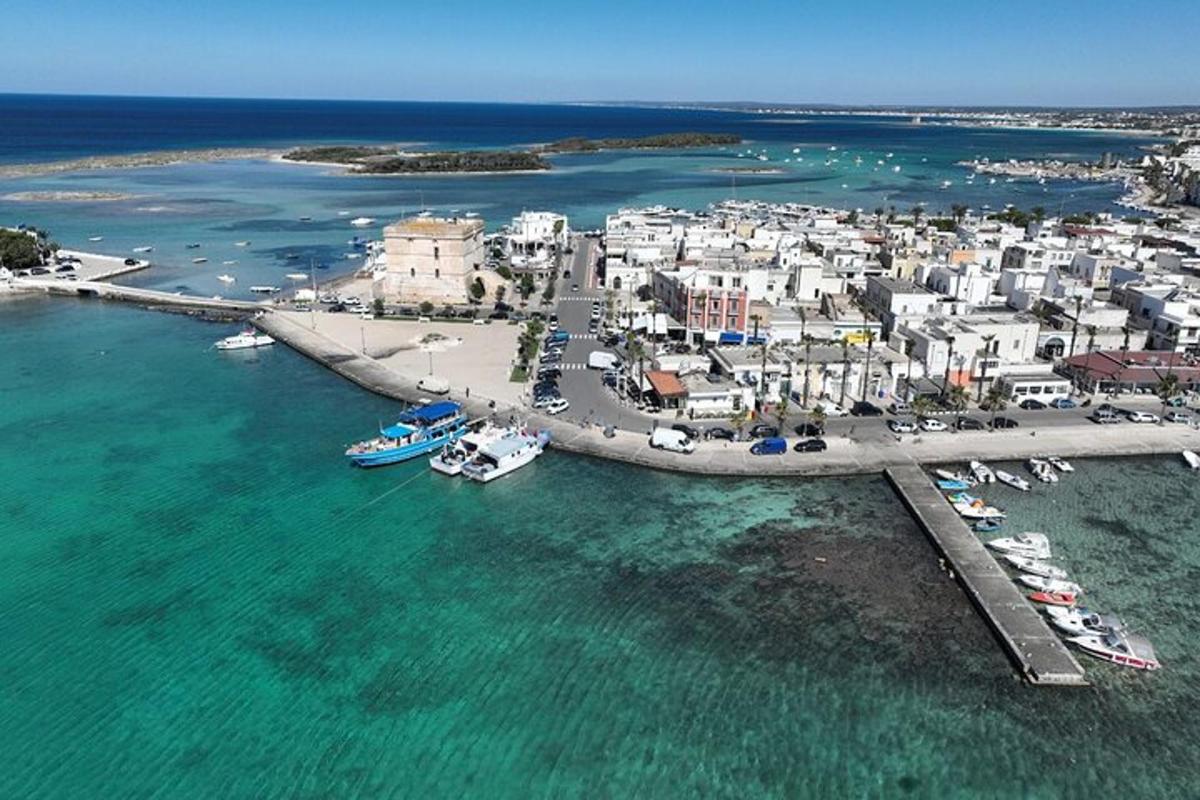 an aerial view of a harbor with boats in the water