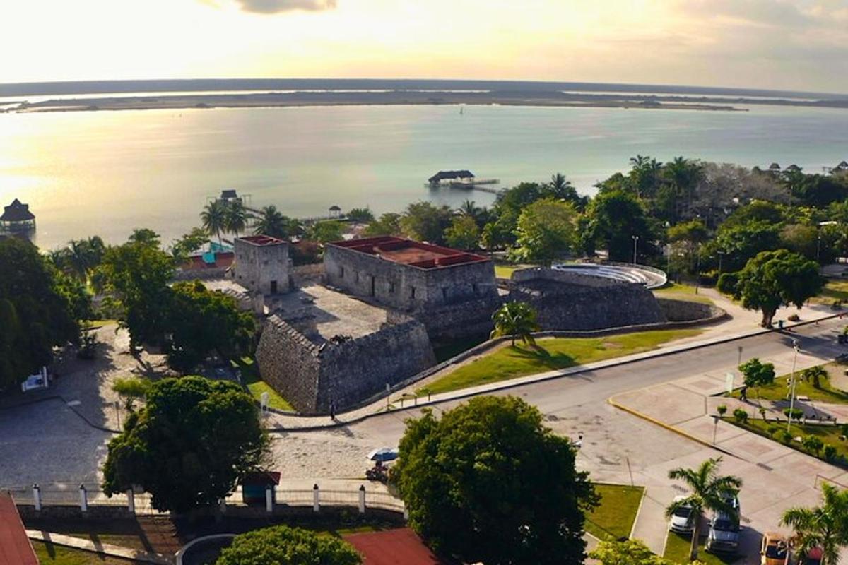 an aerial view of a castle and the water