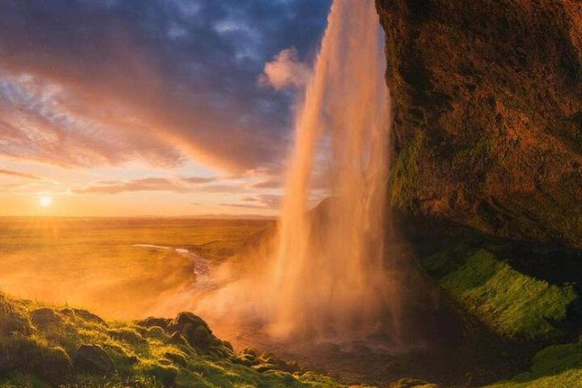 a painting of a waterfall on the side of a mountain