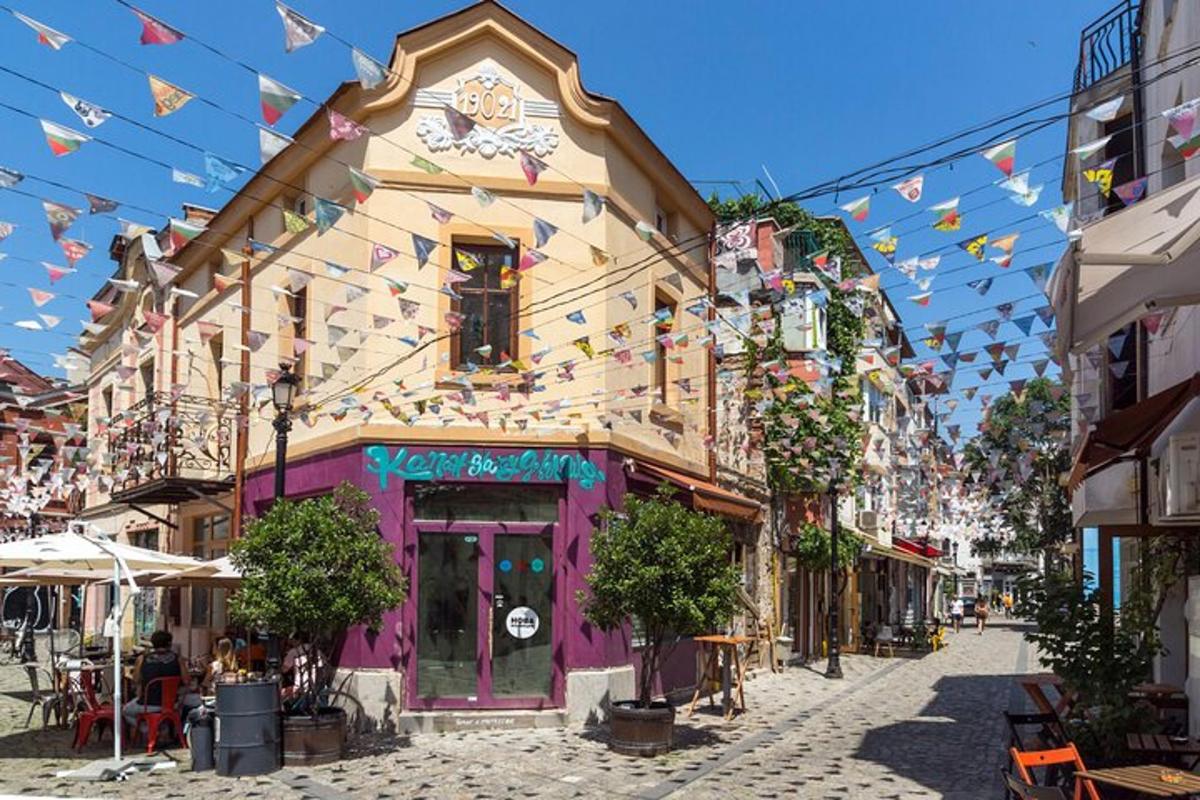 a purple building with a clock on it on a street