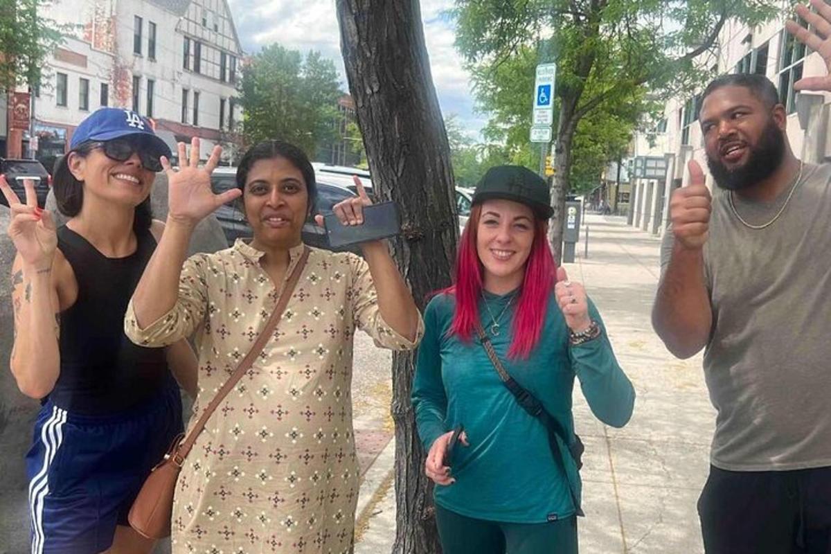 a group of people giving the thumbs up sign