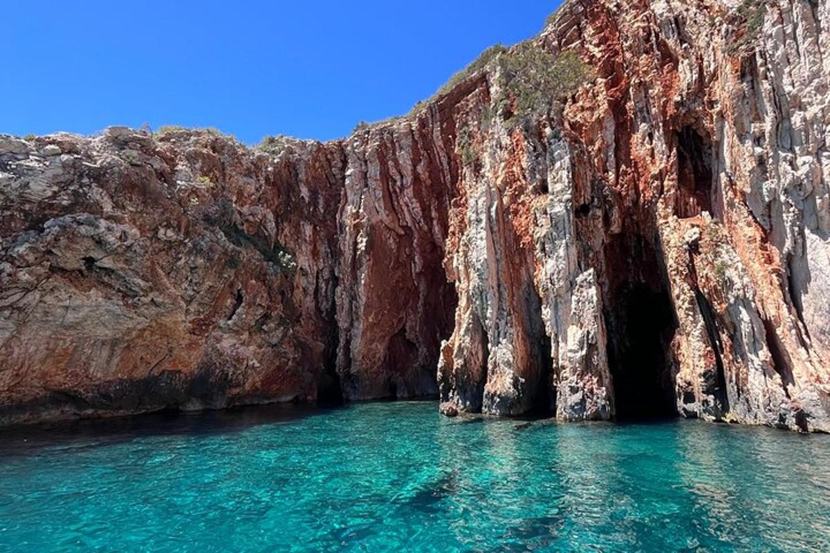 a cave in the side of a rocky cliff