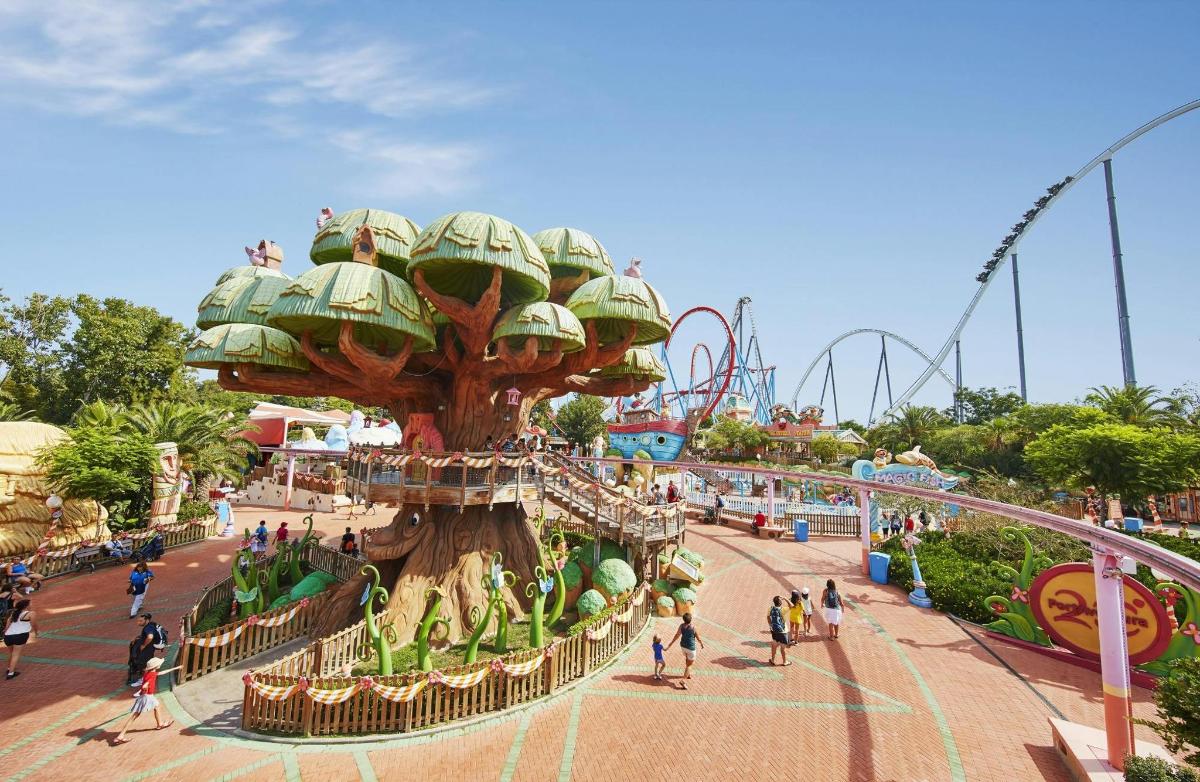 a ride at a theme park with a tree