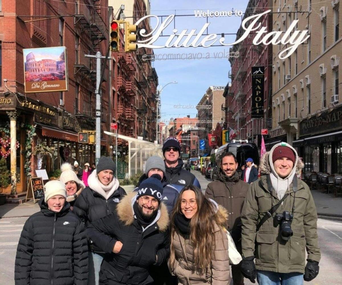 a group of people standing on a city street