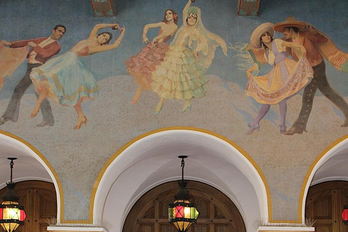a painting of people on the ceiling of a building