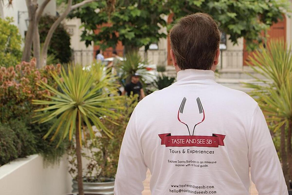 a person wearing a white shirt with a fork and betrayal sign