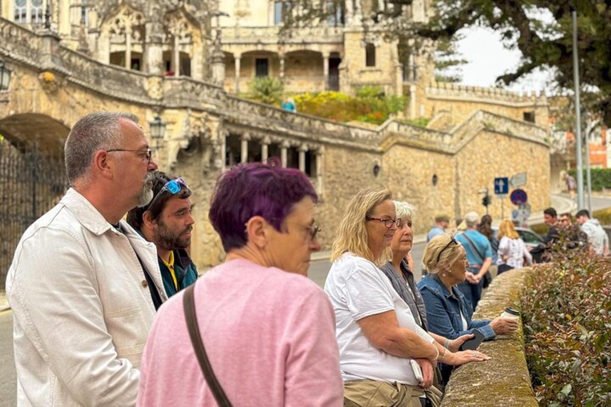 a group of people standing outside of a building