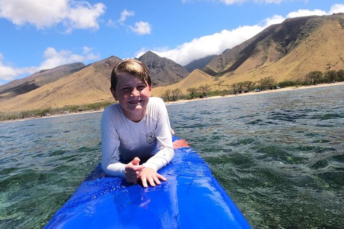 a young girl riding on a blue raft in the water