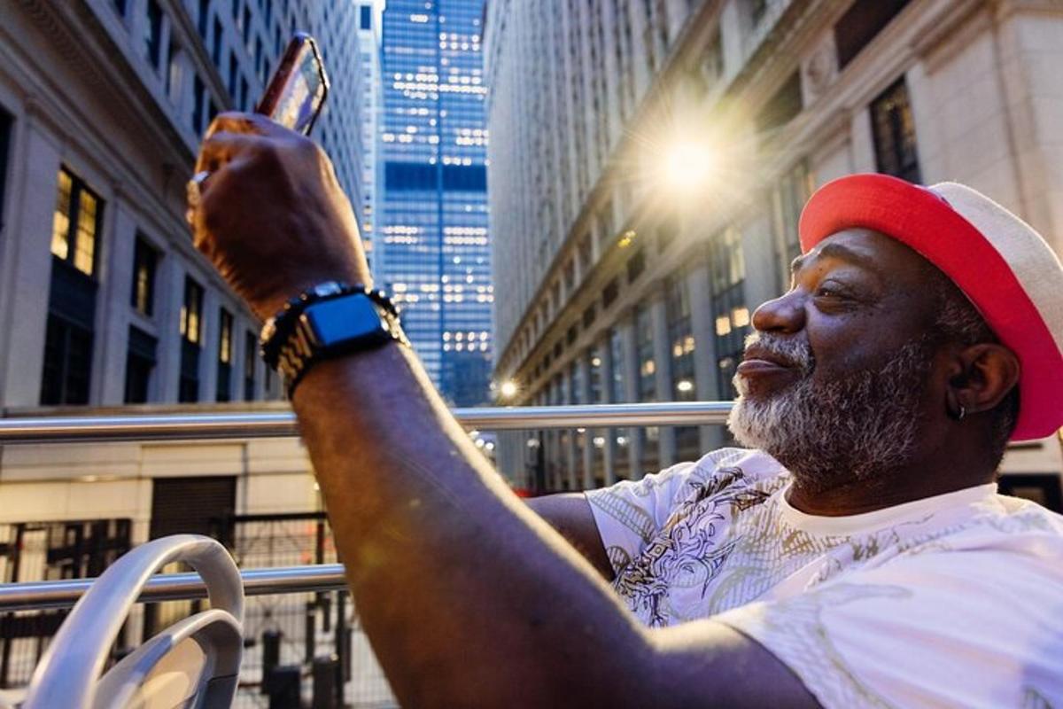 a man looking at his cell phone in the city
