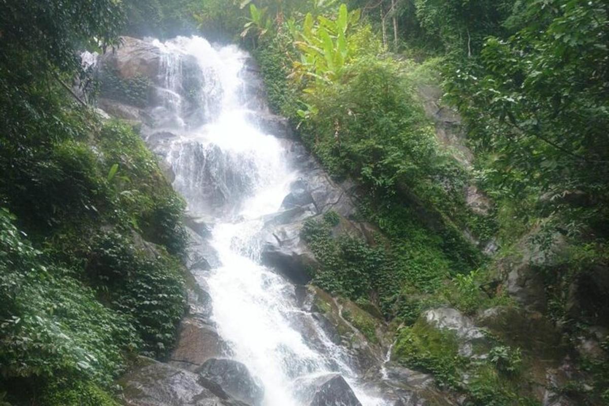 a waterfall on the side of a rocky mountain